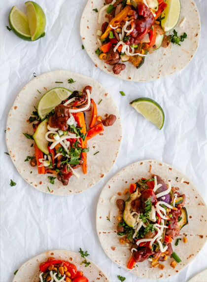 Vegetable-filled tortillas with fresh herbs and lime.