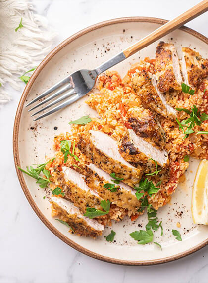Garlic Parmesan chicken with cauliflower rice.